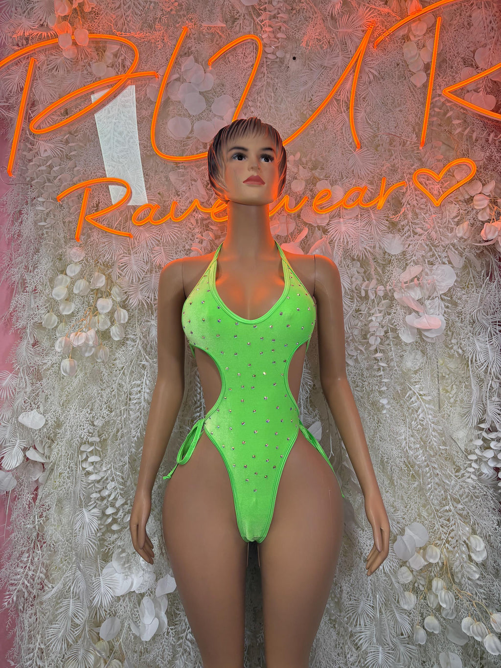 Neon green mesh bodysuit with front cutout and high-leg cheeky fit, tie accents