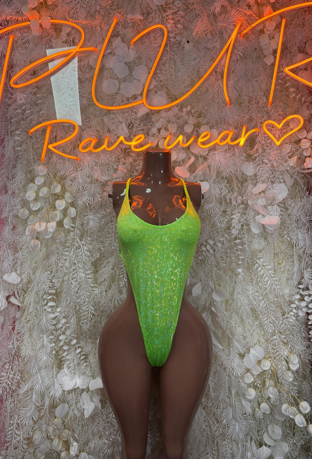 Neon green sequin bodysuit with thong-style coverage, high-cut one-piece