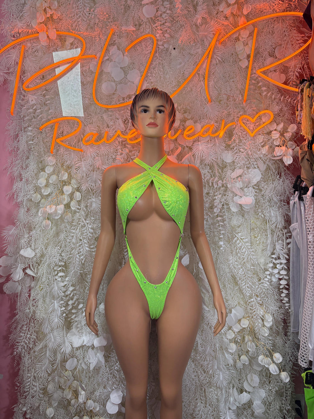 Neon green sequin halter bodysuit with open back and crisscross straps