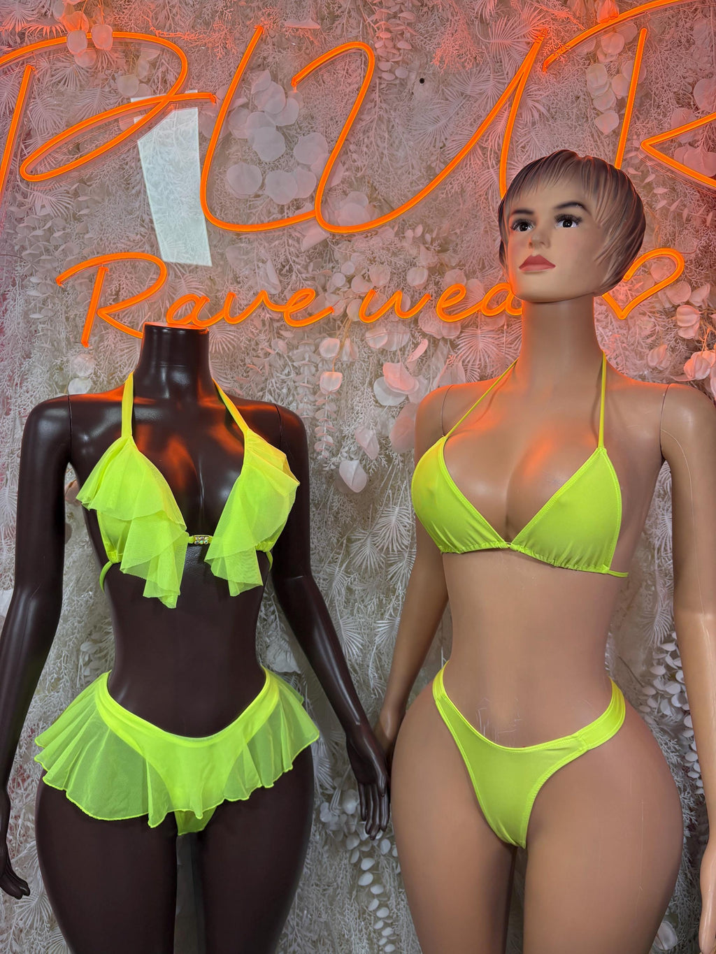 Neon green ruffled triangle bikini set on mannequin, with tie straps and high-cut bottoms