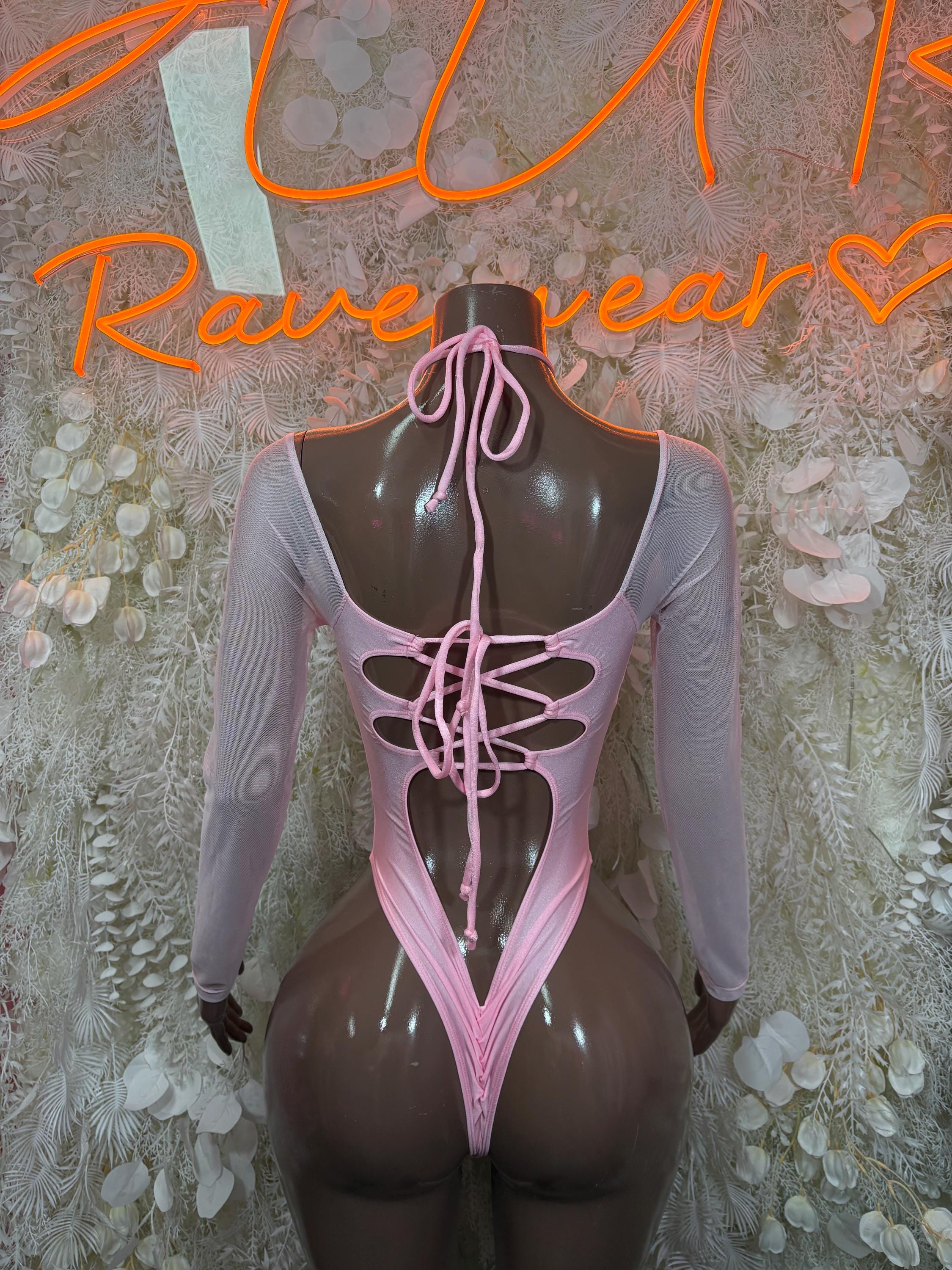Baby pink long-sleeve bodysuit with center-back lace-up and thong-style cutout