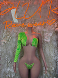 Green two-piece rave set with long-sleeve crop top and thong bikini bottoms