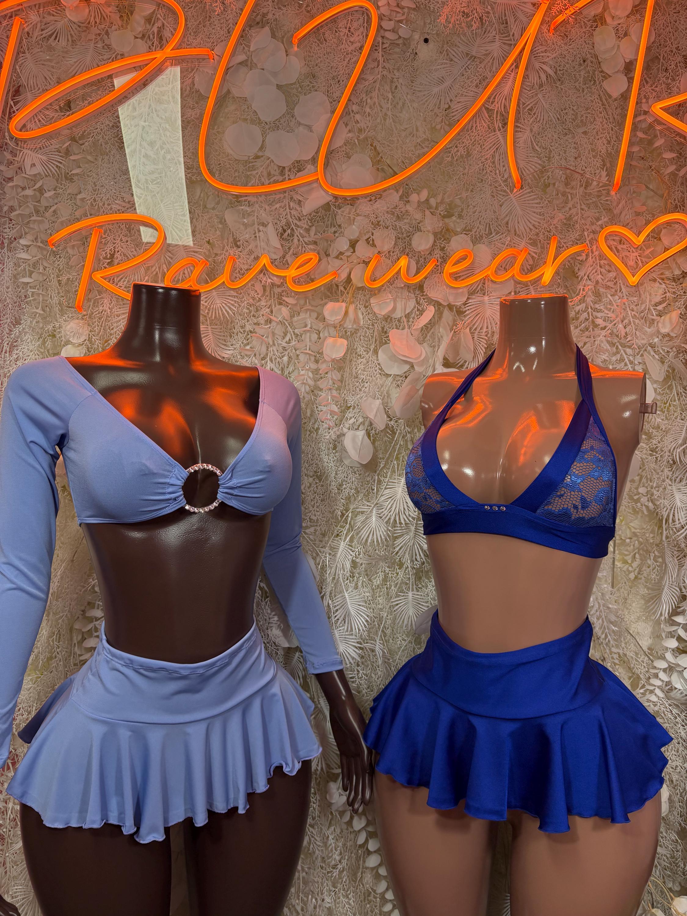 Light blue and royal blue two-piece dance outfits with long sleeves and ruffled skirts
