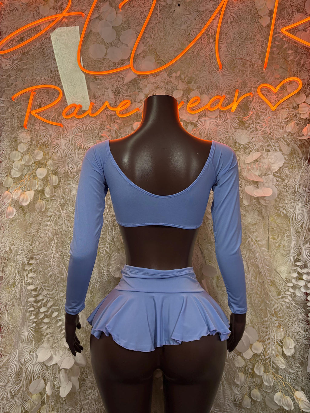 Light blue long-sleeve crop top with back and ruffled mini skirt two-piece outfit