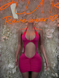 Fuchsia halter mini dress with chest and waist cutouts, ruched front