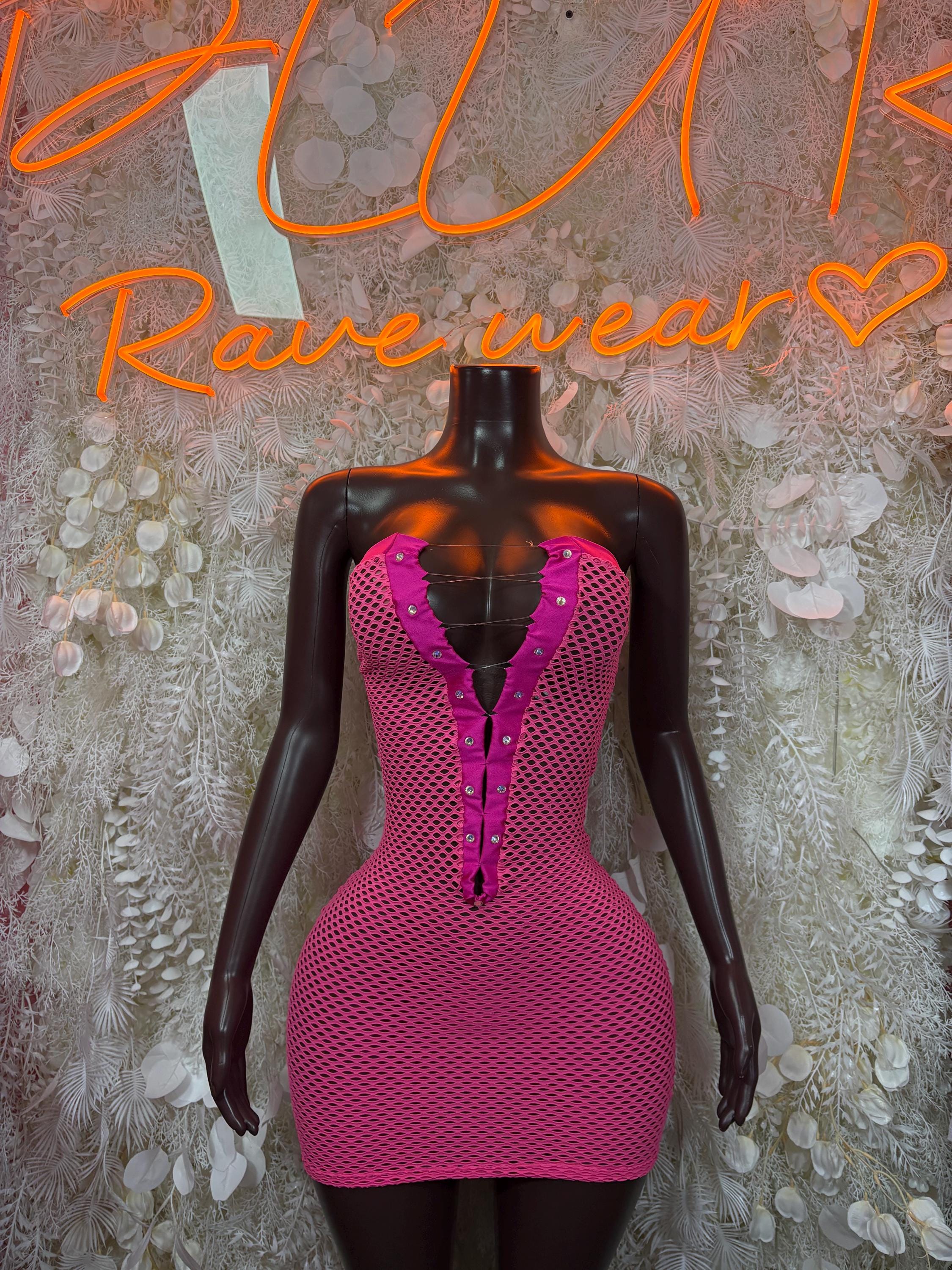 Pink fishnet mini dress with deep V neckline and front zipper on mannequin