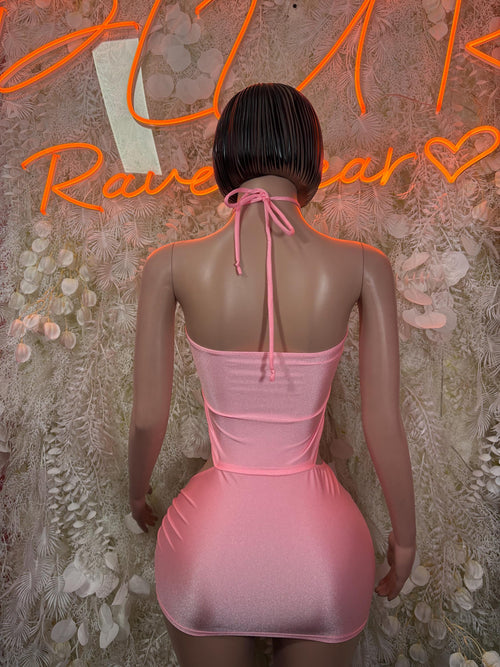 Pink mini dress back view with halter straps and ruched skirt with drawstring