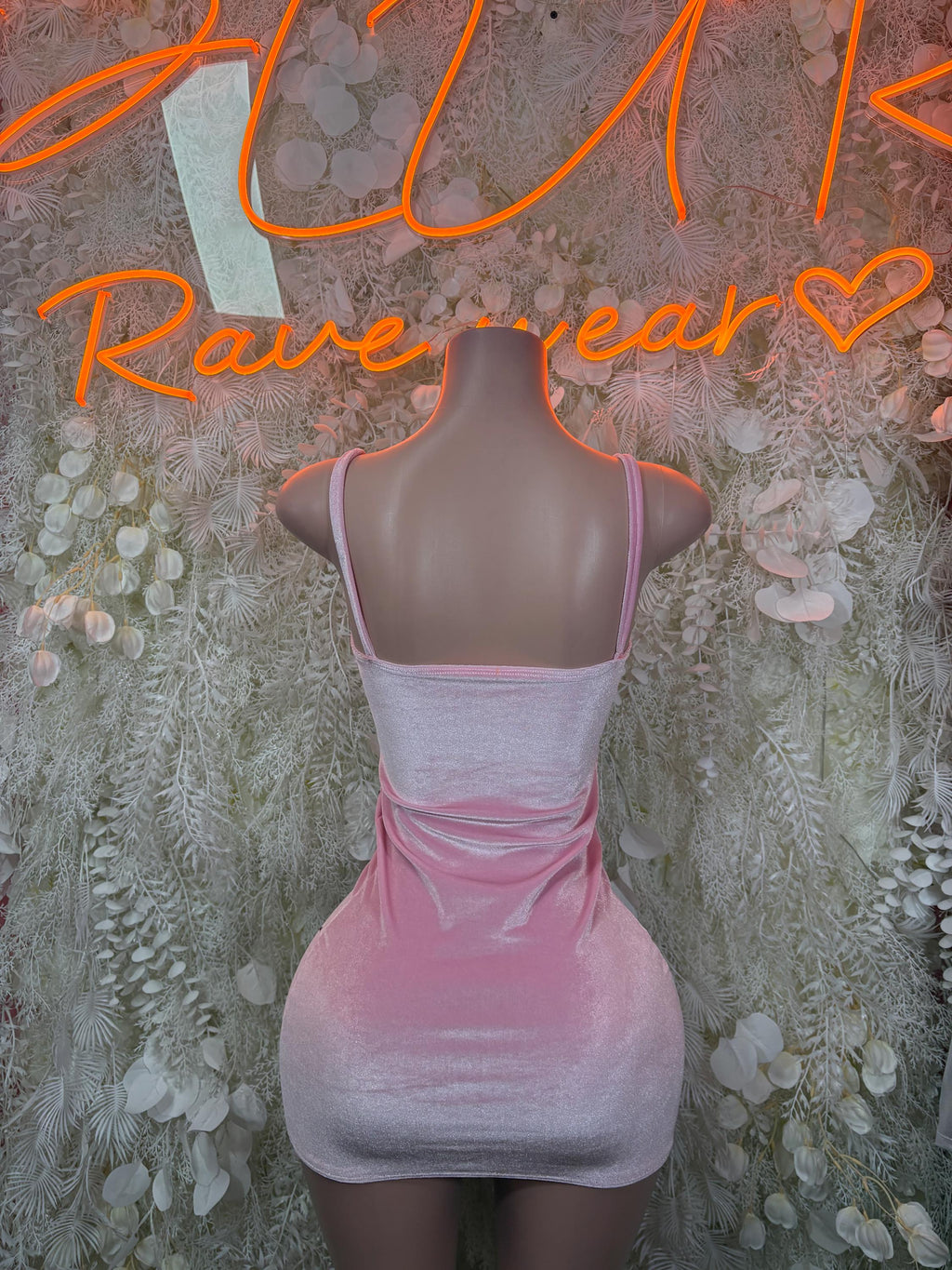 Pink velvet bodycon mini dress with wide shoulder straps and gathered center seams