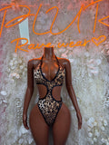 Leopard-print one-piece bodysuit with halter straps and high-cut cheeky fit