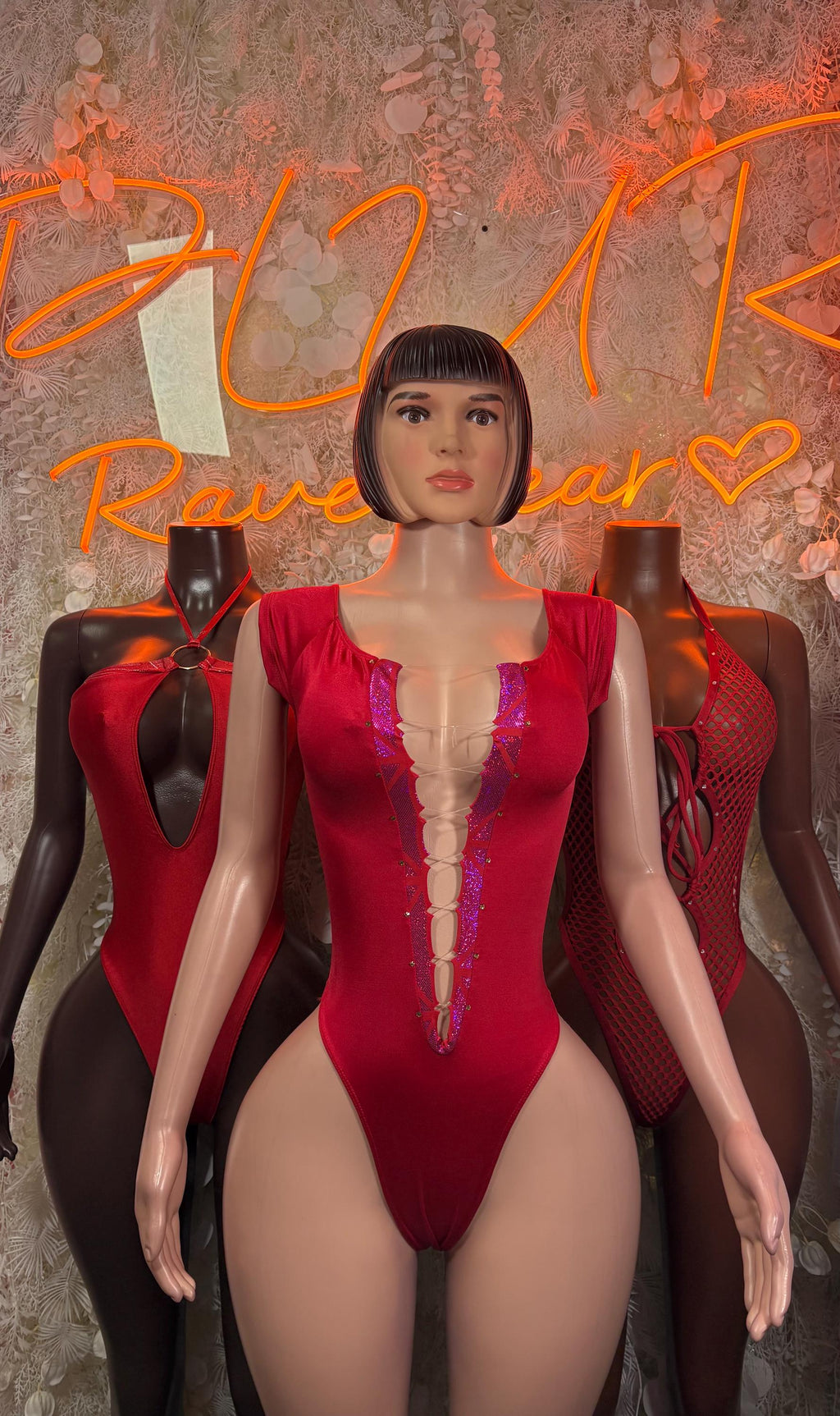 Red fishnet bodysuit with plunging V front and tie straps at bust