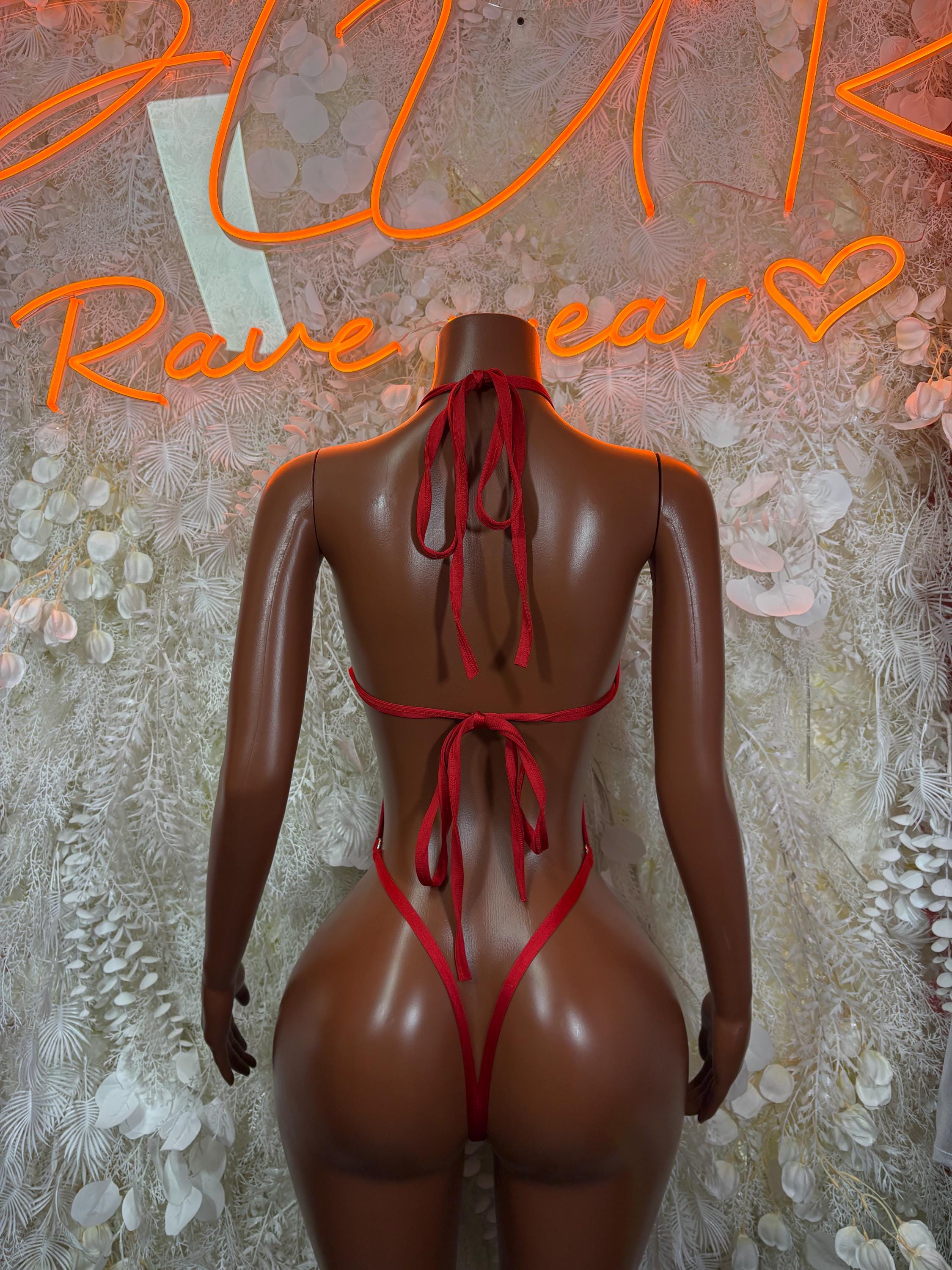 Red fishnet bodysuit with lace-up open back and tie straps