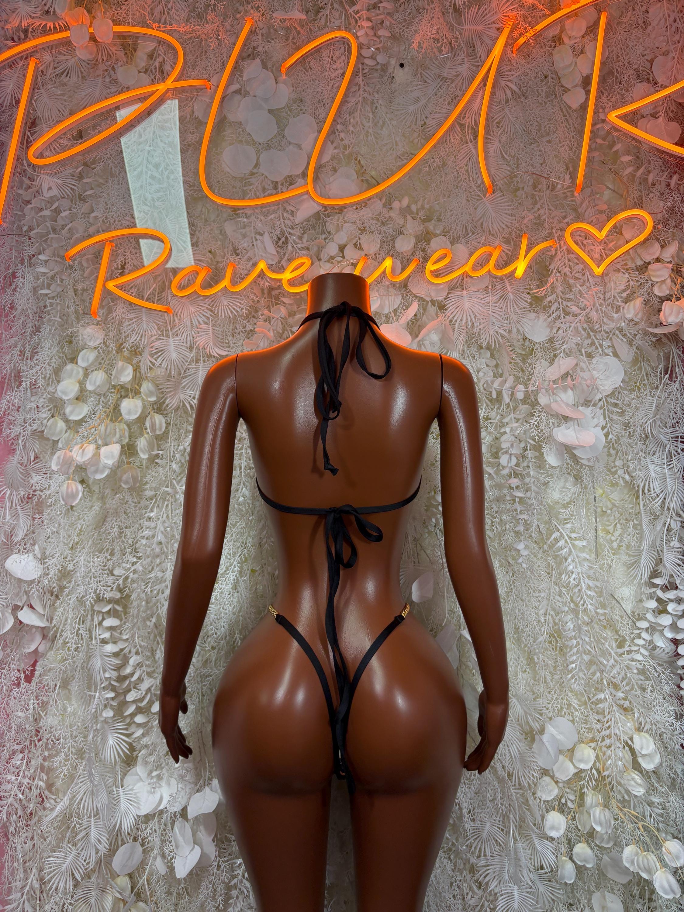 Leopard print open-back dance bodysuit with black halter ties and V-shaped back