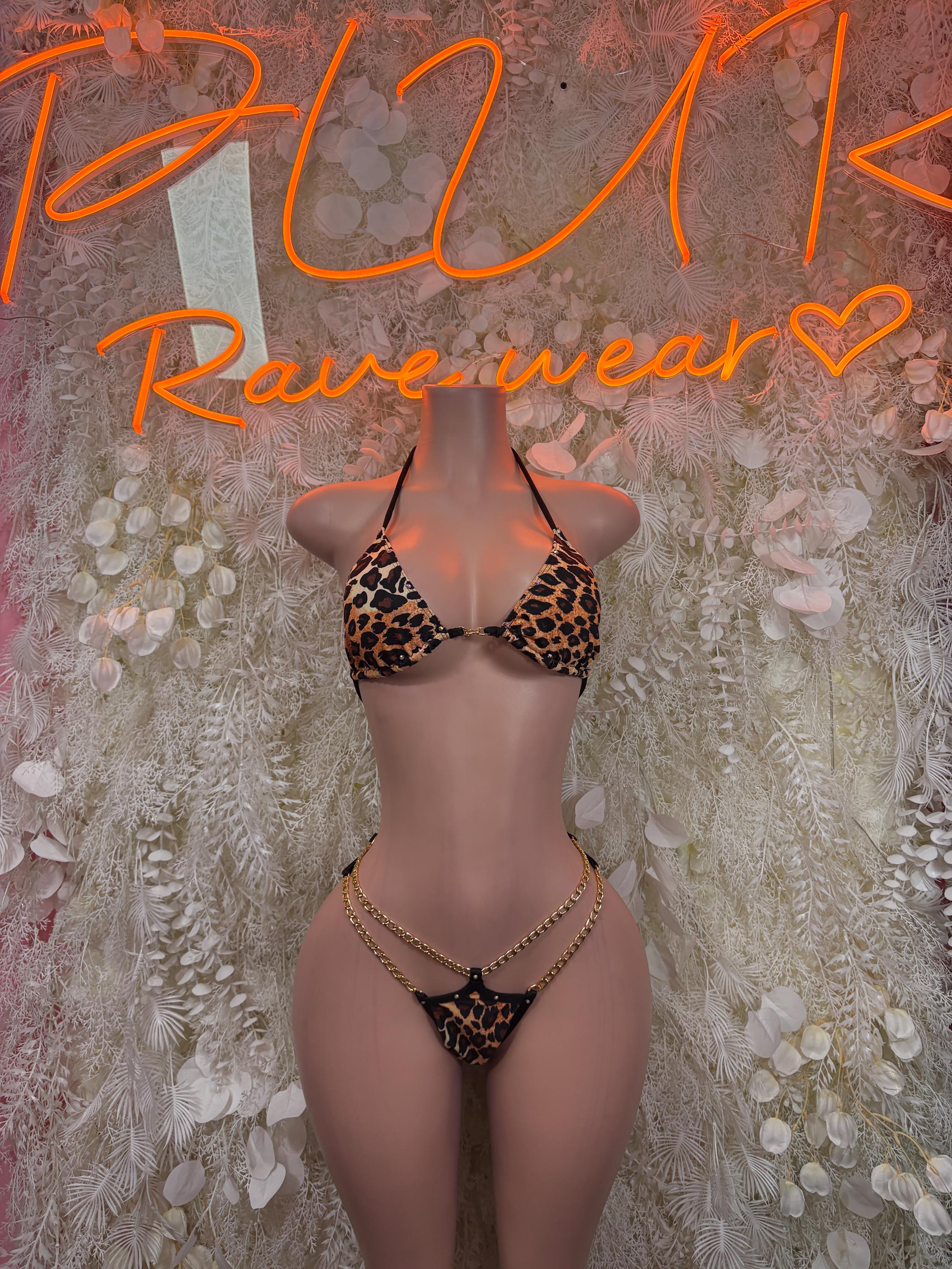 Leopard print two-piece dance bodysuit with black tie-back top and chain thong