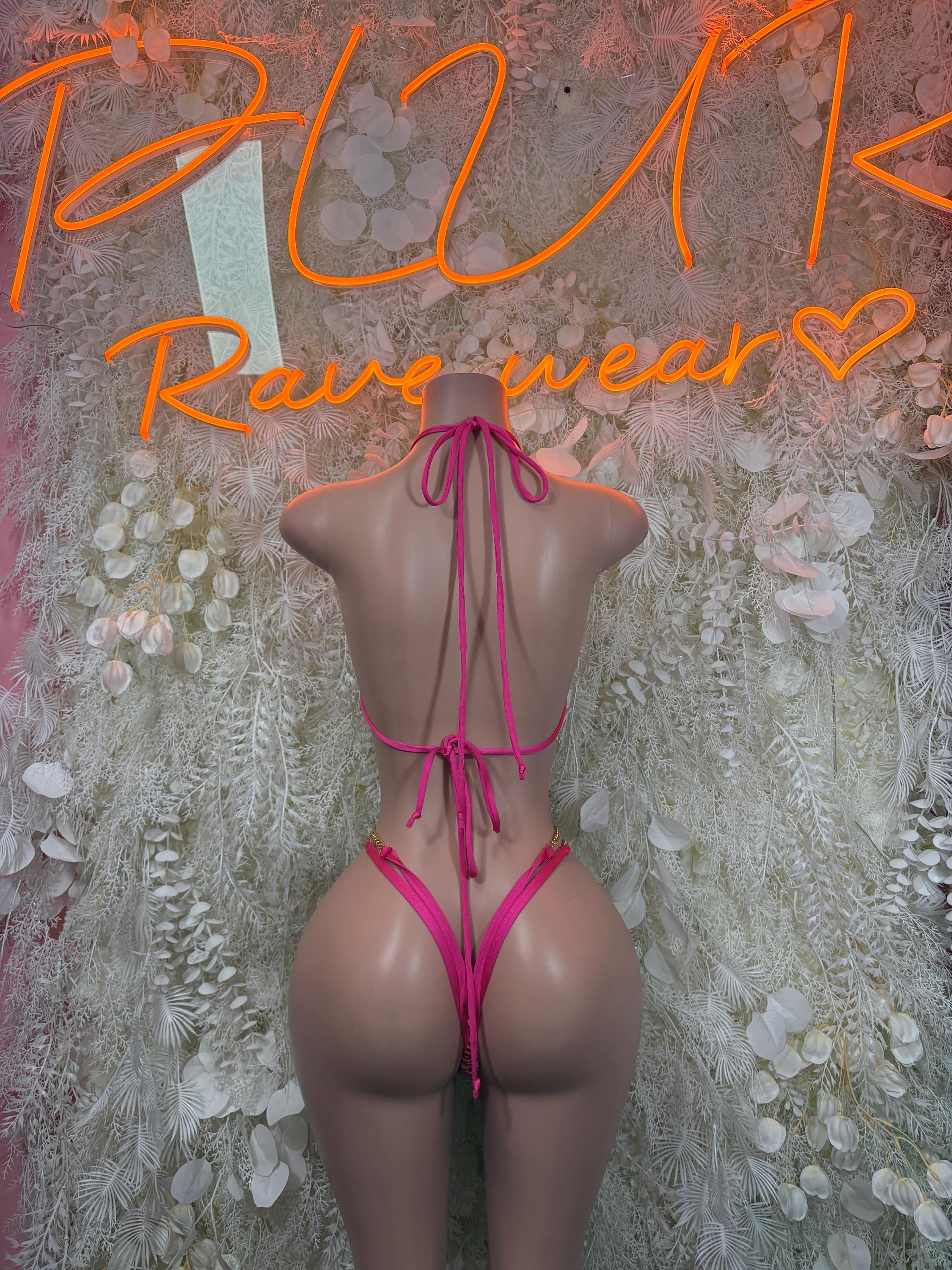 Two-piece bodysuit back view with cheetah print straps and adjustable tie closures