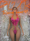 Pink cheetah-print one-piece bodysuit with lace-up front and thin straps