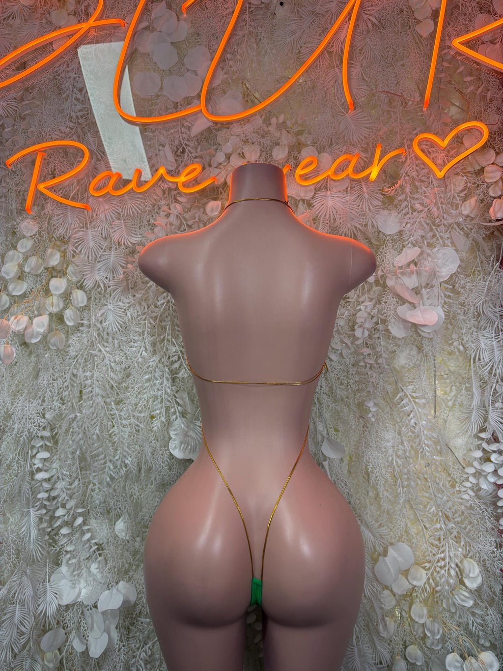 Green glitter bodysuit back view with thong straps