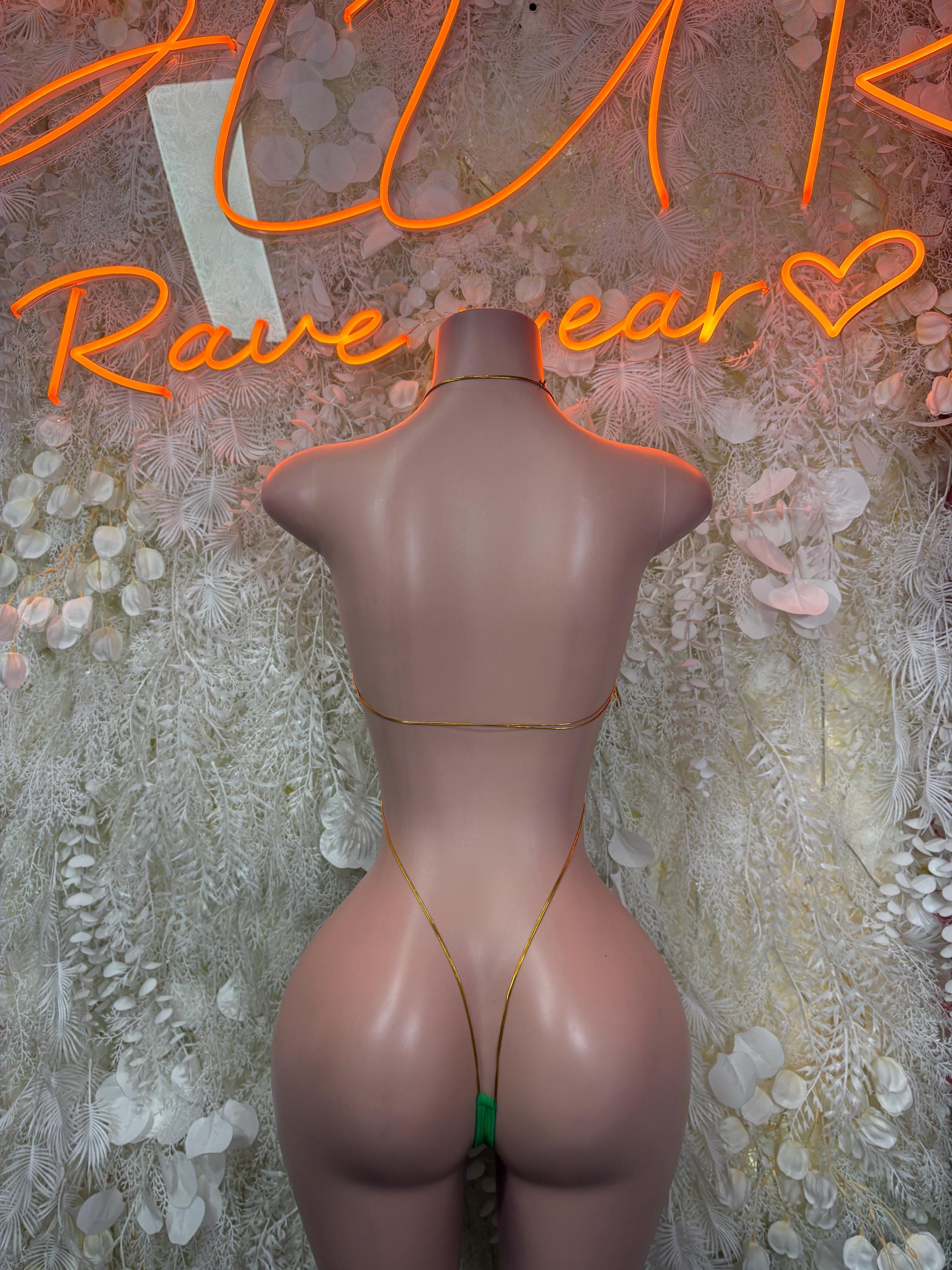 Green glitter bodysuit back view with thong straps