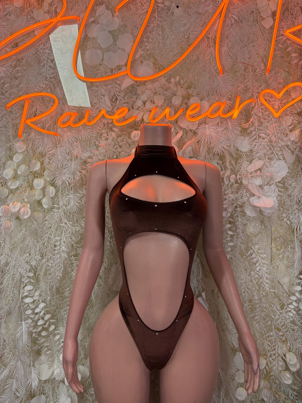 Dark brown velvet bodysuit with oval chest cutout, high-cut one-piece