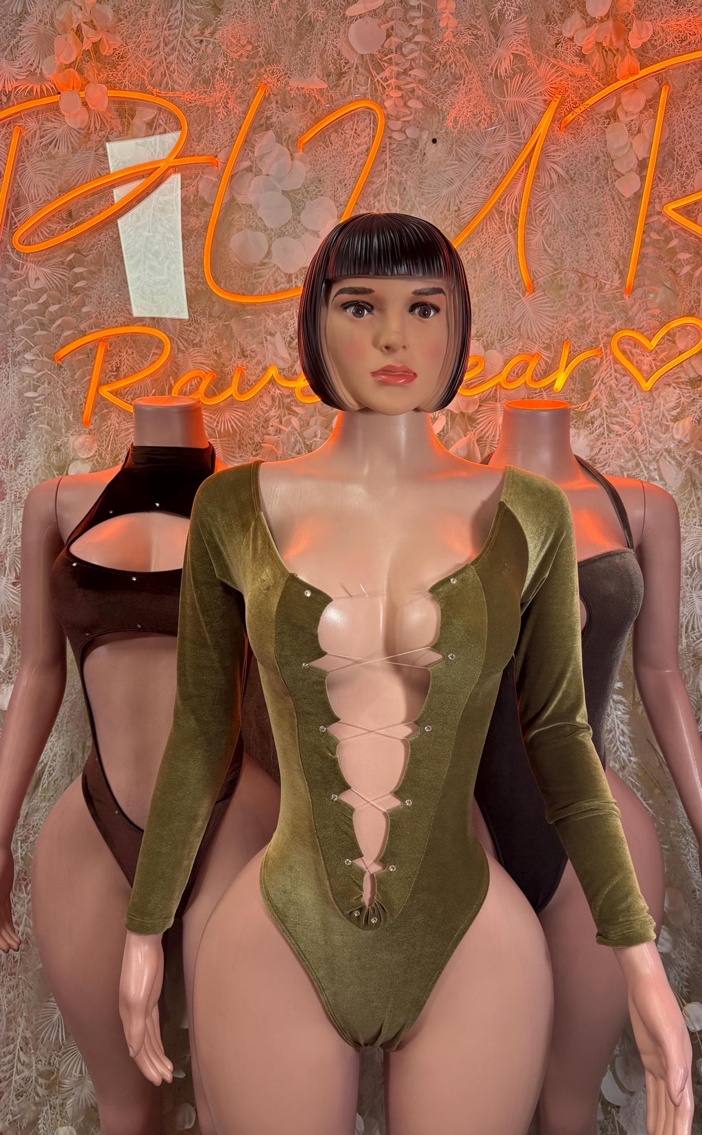 Velvet green long-sleeve bodysuit with deep V bust and thong-style bottom.
