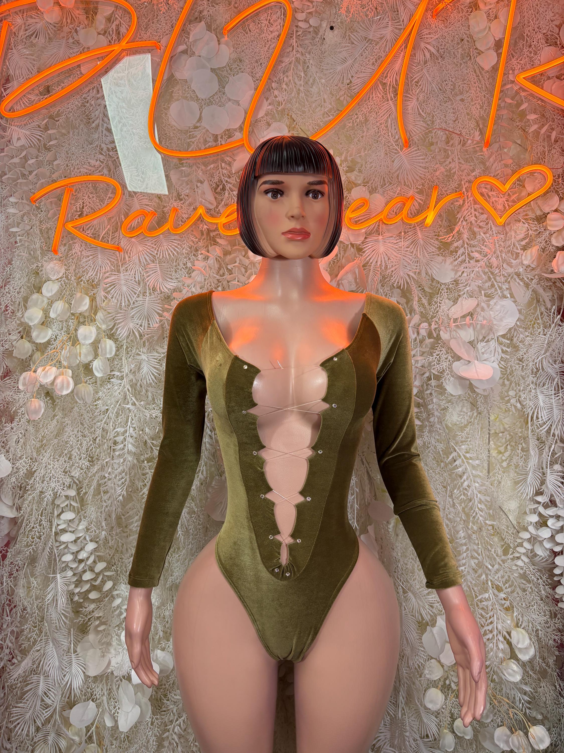 Velvet green long-sleeve bodysuit with deep V neckline, fitted velvet stretch.