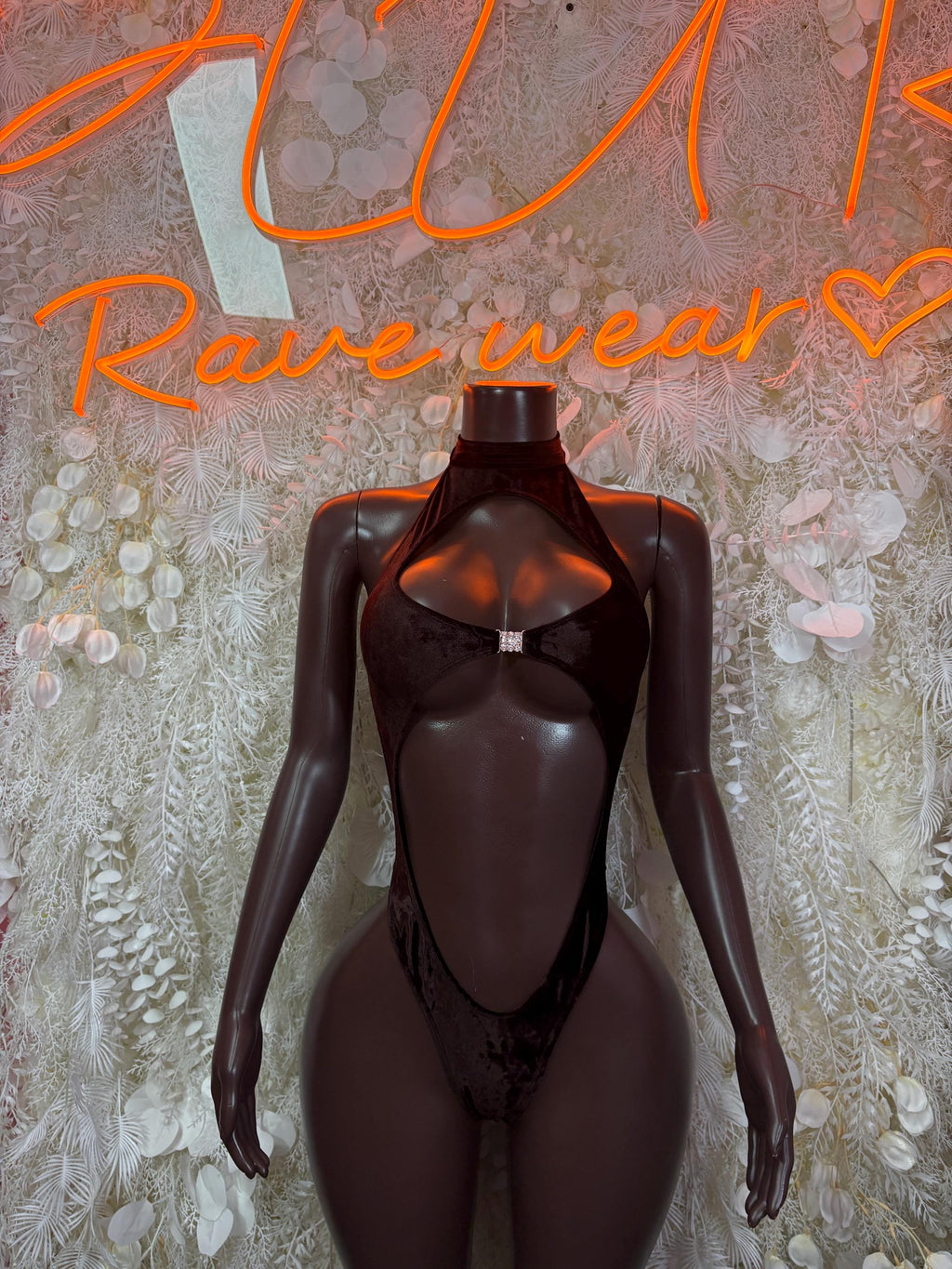 Dark brown velvet bodysuit with long sleeves, halter neck, and front keyhole cutout