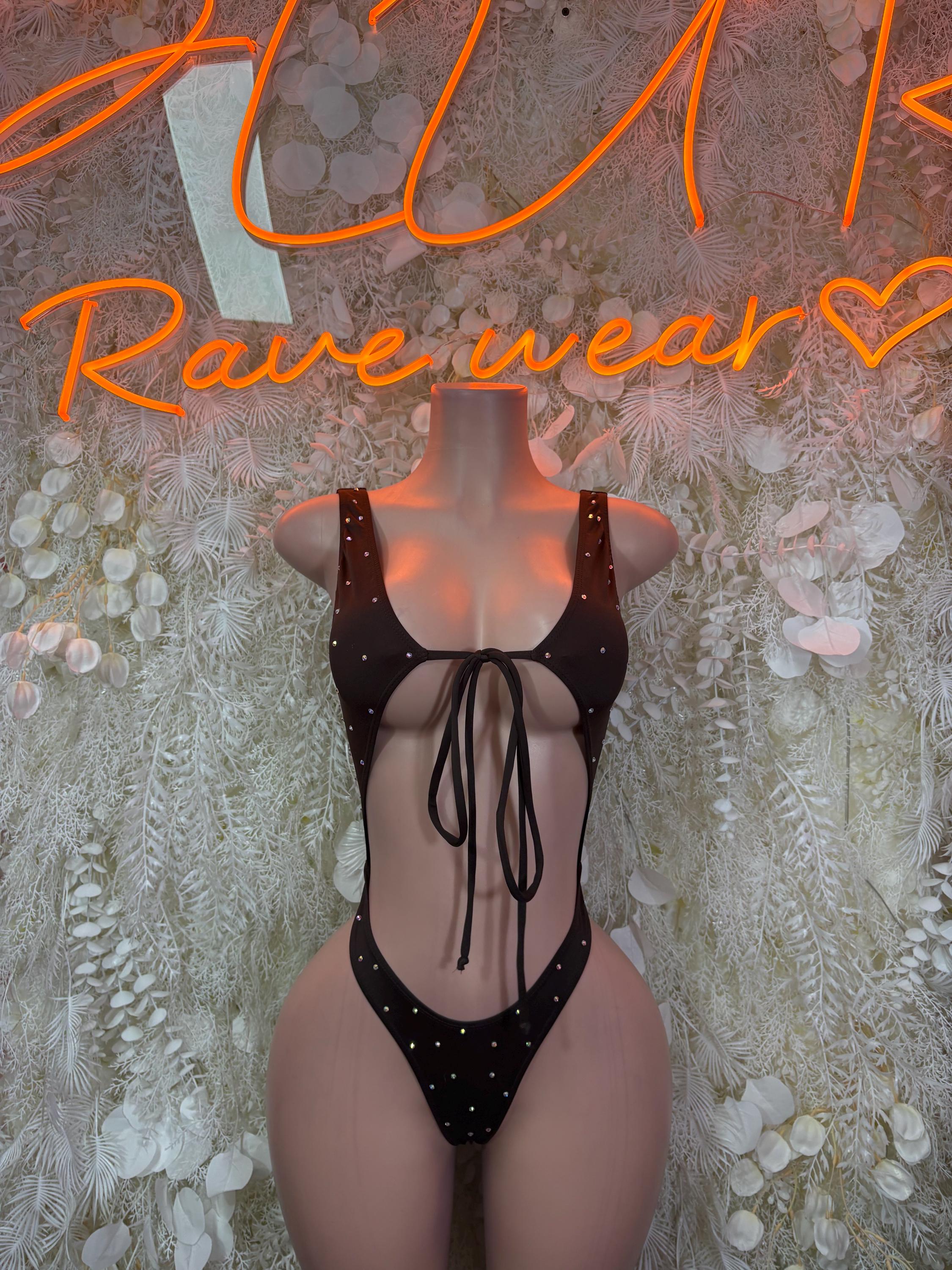 Black cutout bodysuit with heart-shaped back and lace-up tie, thong front