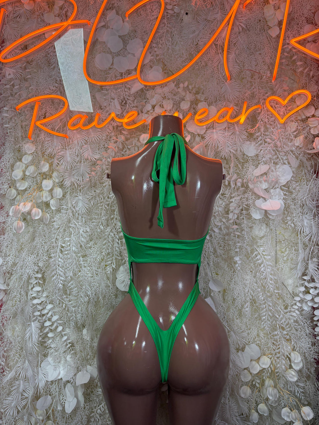 Green backless rave bodysuit with halter ties and thong-style bottom