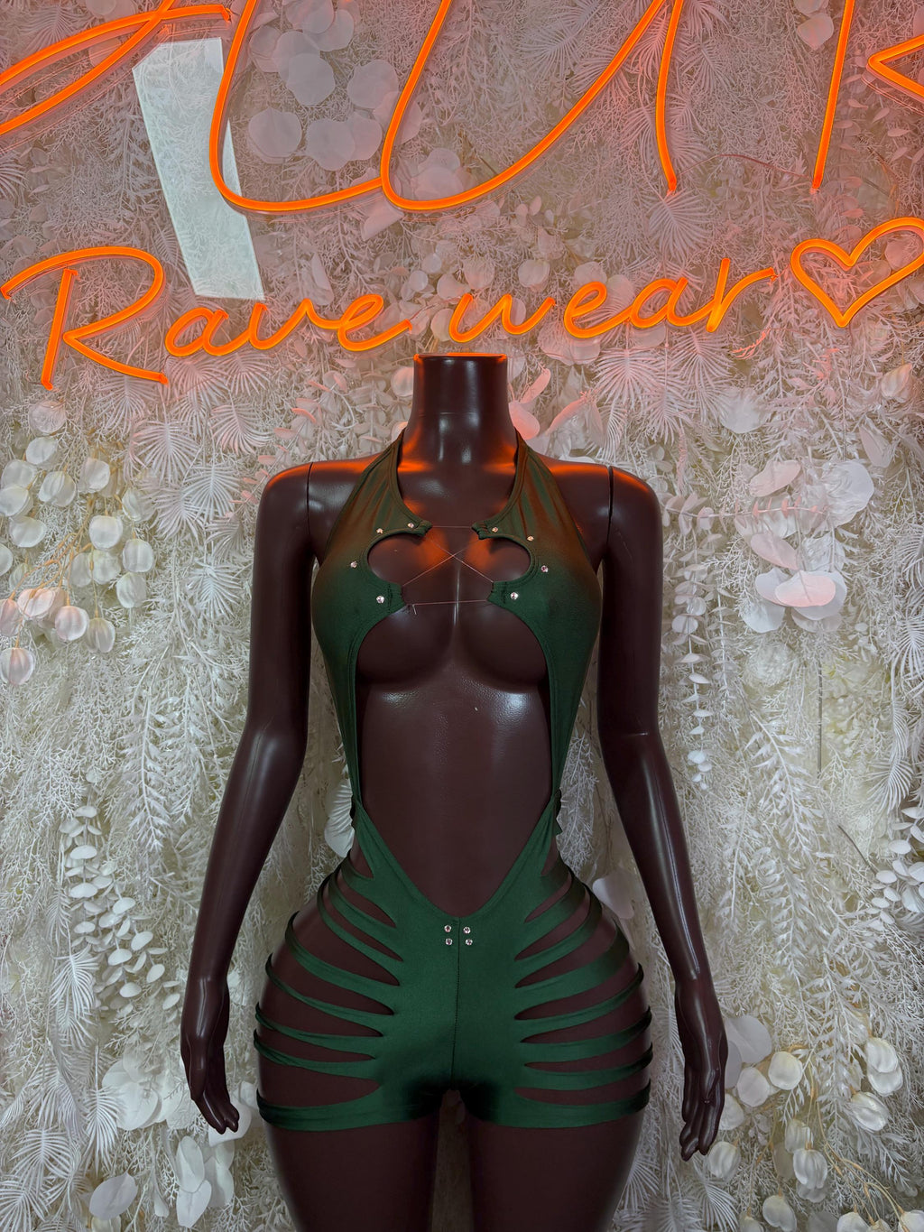 Green one-piece rave bodysuit with V neckline, striped side cutouts and snap-button front