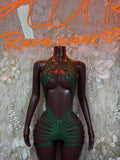 Green one-piece rave bodysuit with V neckline, striped side cutouts and snap-button front