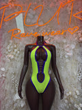 Neon green and blue halter bodysuit with high-cut legs and oval cutout details