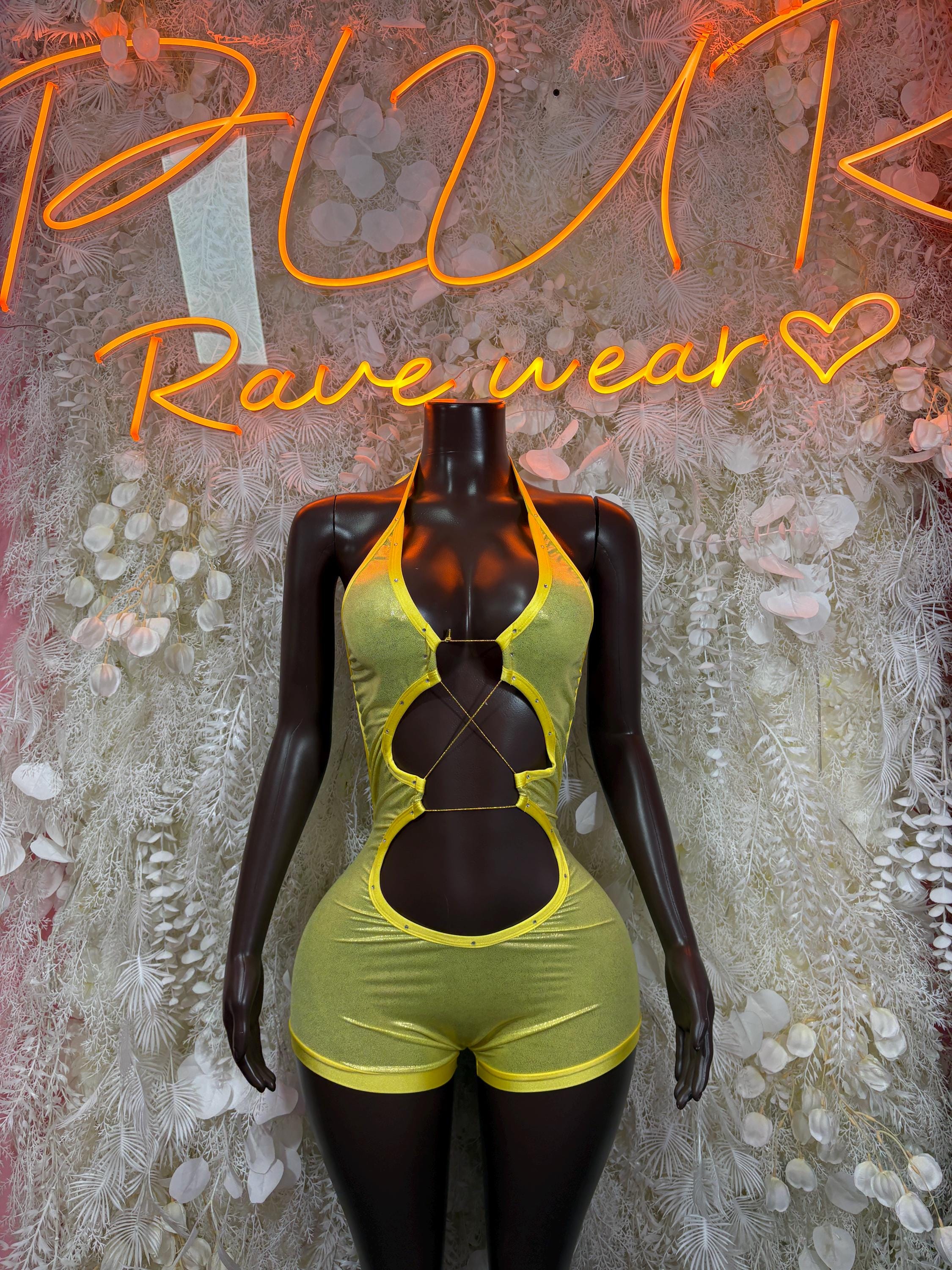 Metallic yellow bodysuit on mannequin with halter neckline and cutout back straps