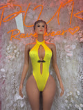 Yellow halter bodysuit with chest cutout and black clasp, front view