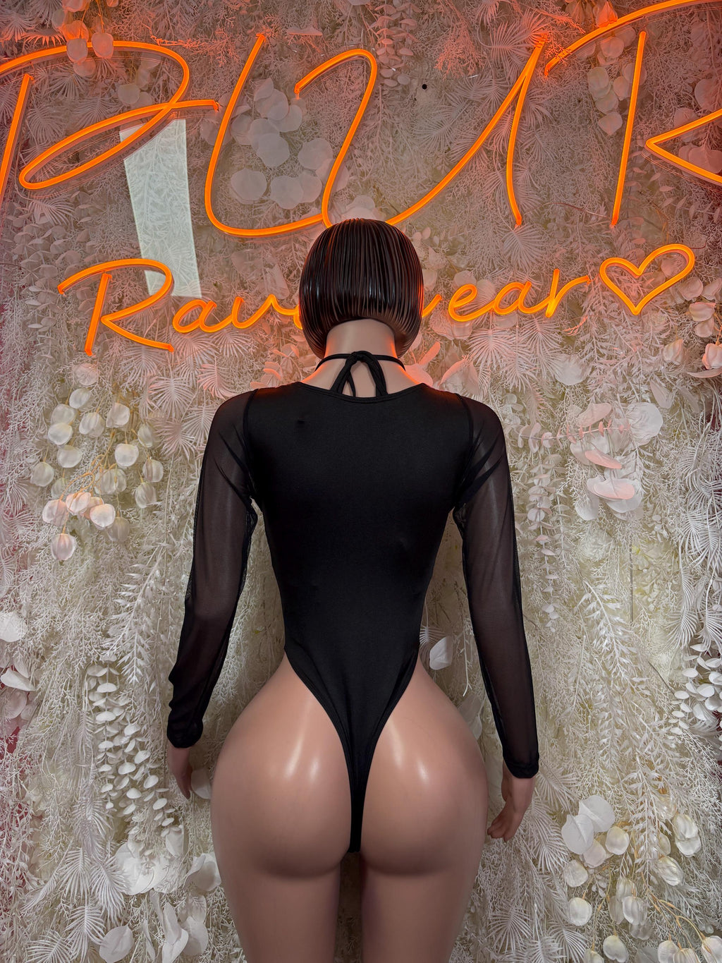 Bottlegirl cow print bodysuit back view with crisscross straps and long sheer sleeves