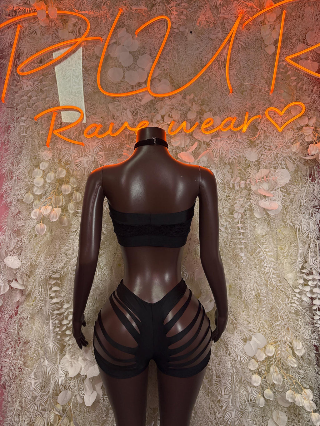 Black two-piece bodysuit set with backless bandeau top and striped strappy bottoms