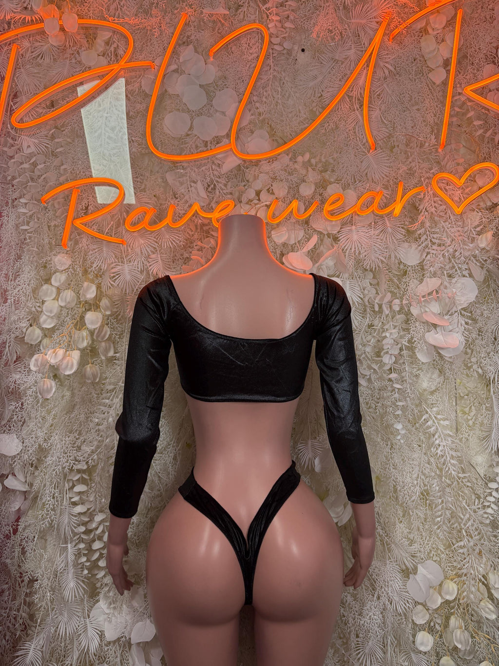 Black long-sleeve crop top set with lace-up straps and high-cut thong bottoms