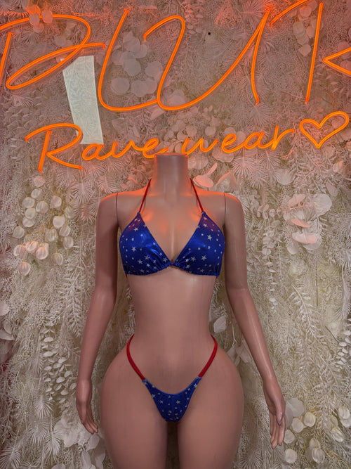 Star-print blue triangle bikini with red trim, front view
