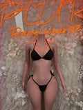 Black bikini two-piece: tie halter triangle top and string side bottoms