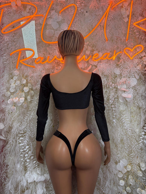 Black long-sleeve crop top and bikini bottoms, back view