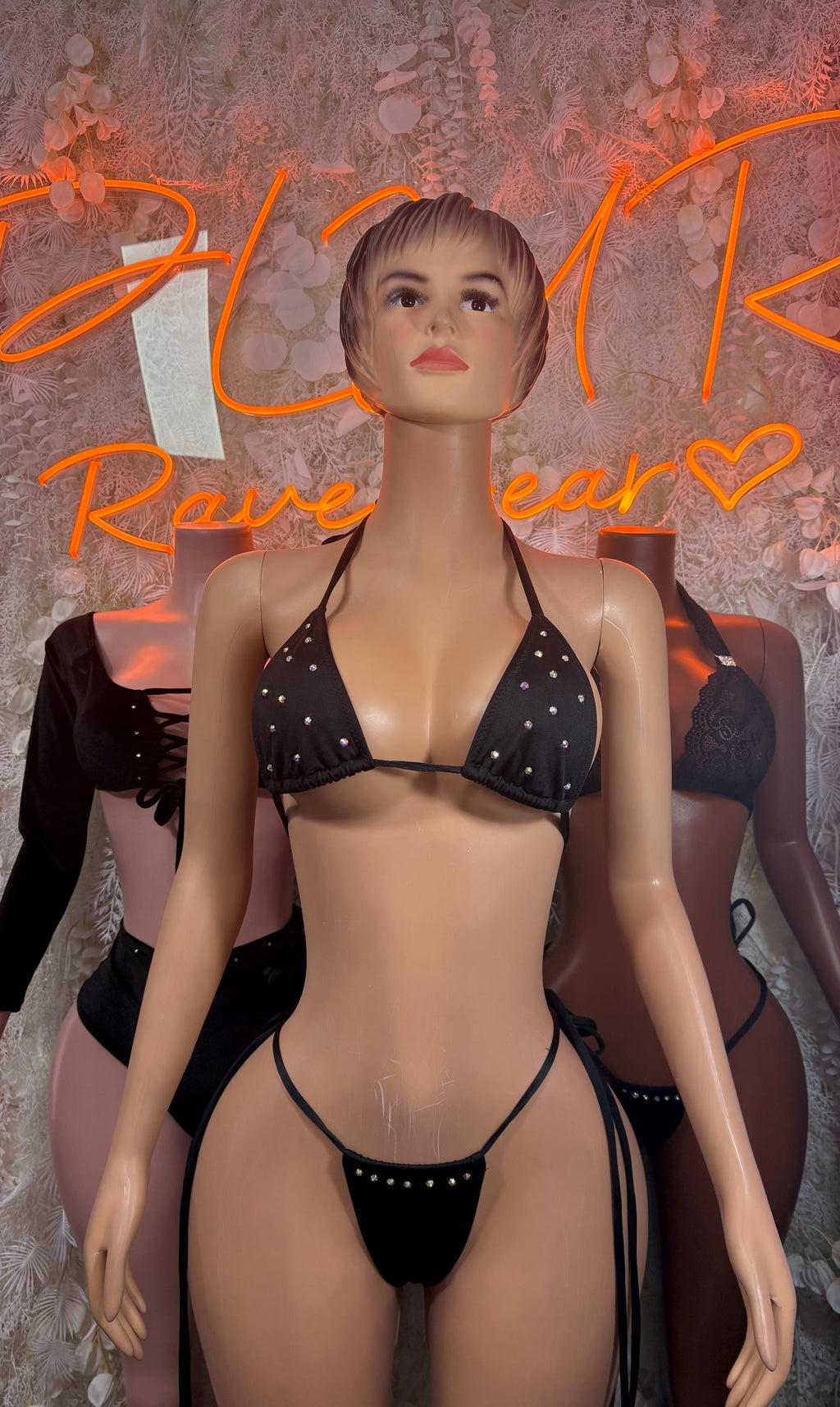Black triangle bikini set with bead-like accents, adjustable halter straps and bottoms