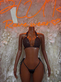 Black two-piece bikini set with triangle lace bra and strappy thong bottoms