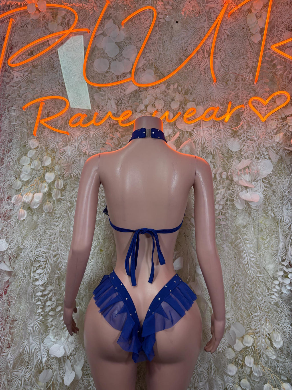 Royal blue two-piece bikini set, tie-back halter top and ruffled back bottoms.