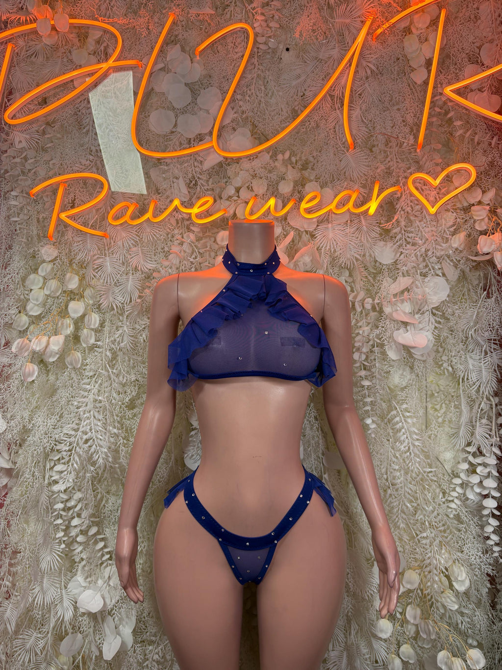 Royal blue two-piece bikini set with halter top and high-leg bottoms, ruffled accents.