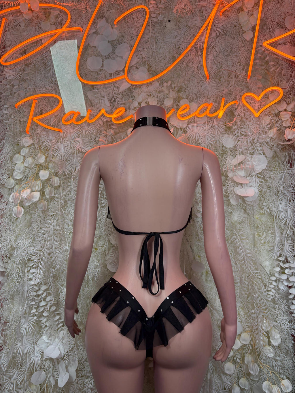 Black rave two-piece outfit, back view with strappy thong and tie ribbon detail