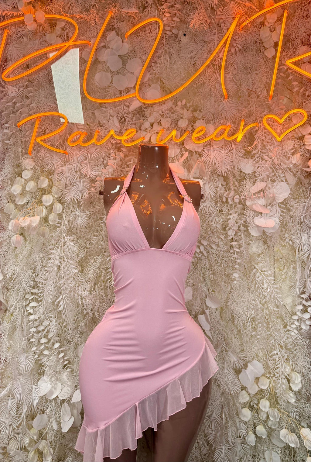 Light pink halter mini dress with V-neck, ruched bodice and layered ruffle hem