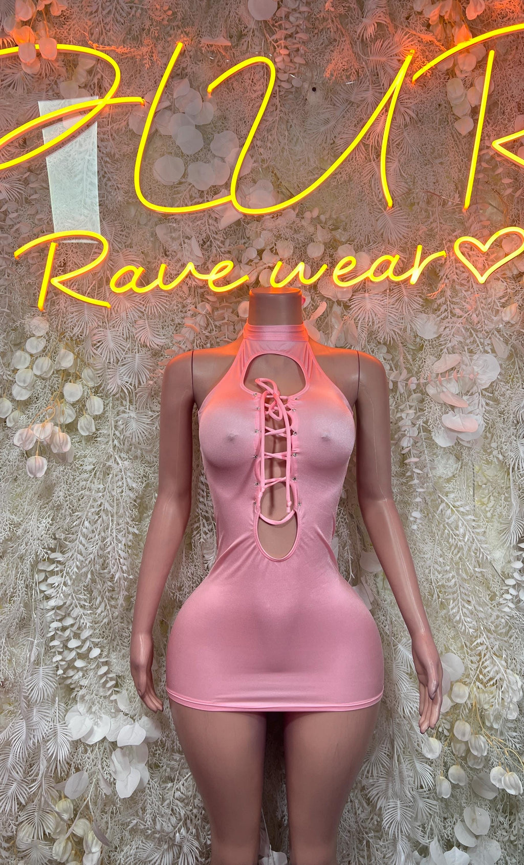 Baby pink mini dress with lace-up cutout front and sleeveless halter neckline