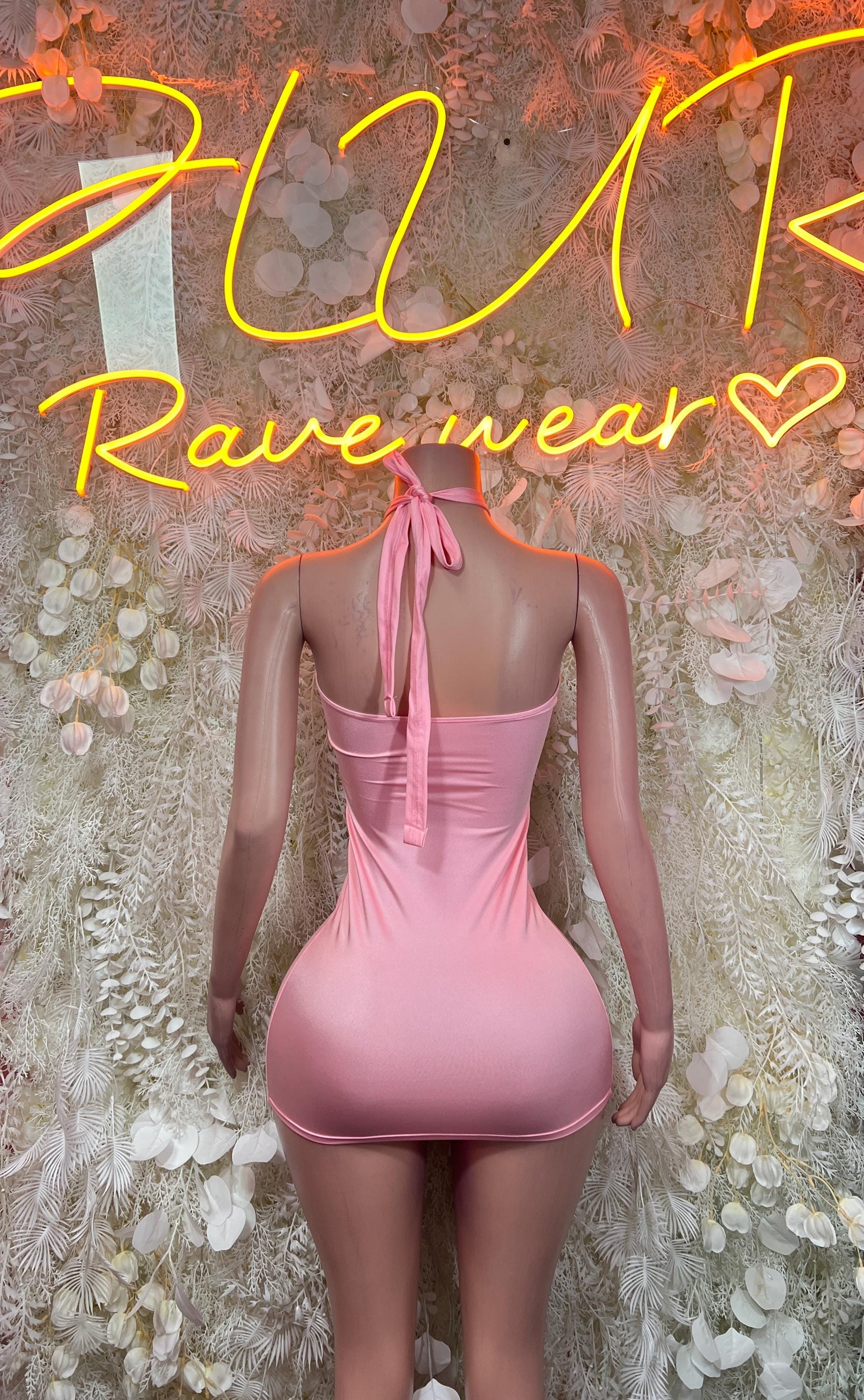 Baby pink backless mini dress with halter tie straps and low back opening