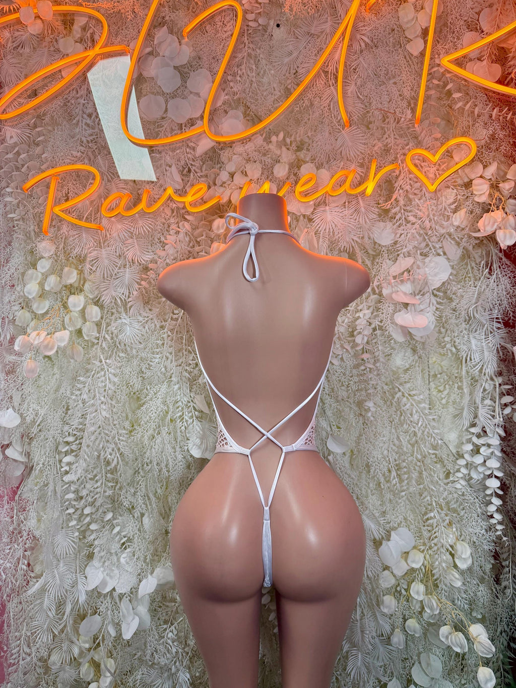 White fishnet bodysuit with crisscross back straps, back view
