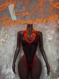 Black fishnet bodysuit with red trim, low-cut one-piece dance outfit