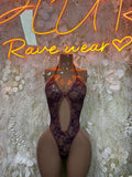 Purple lace festival bodysuit with sheer mesh panels and thong back, halter straps