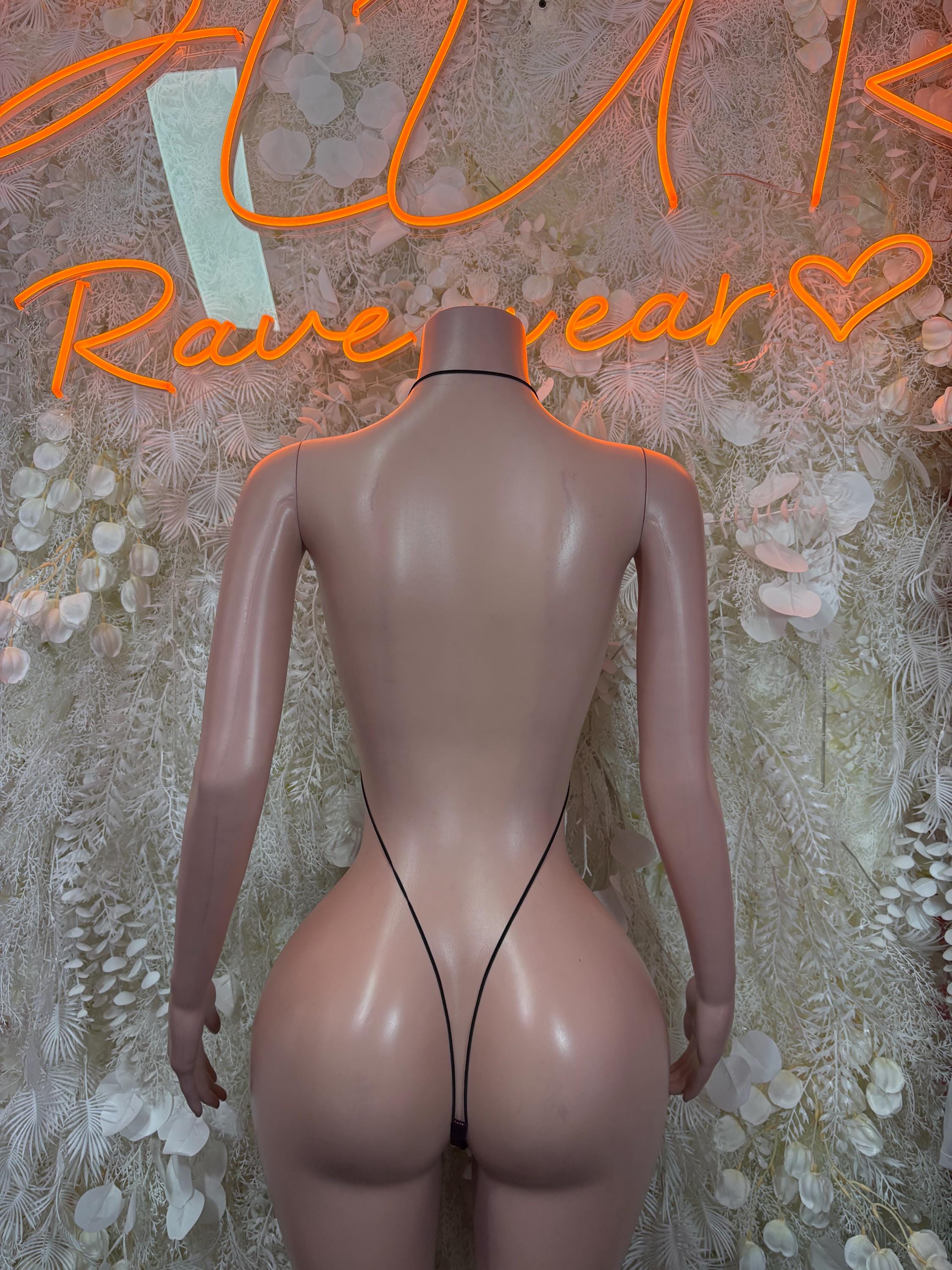 Bodysuit with low back and thin straps, sheer center panel, back view